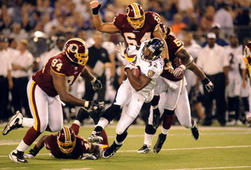 BALTIMORE, MD - AUGUST 13:  Matt Lawrence #32 of the Baltimore Ravens runs with the ball during a NFL preseason football game against the Washington Redskins on August 13, 2009 at M & T Bank Stadium in Baltimore, Maryland.   (Photo by Mitchell Layton/Getty Images)