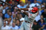 CHICAGO - AUGUST 12: Ryan Howard #6 of the Philadelphia Phillies hits a triple in the first inning against the Chicago Cubs on August 12, 2009 at Wrigley Field in Chicago, Illinois. The Phillies defeated the Cubs 12-5. (Photo by Jonathan Daniel/Getty Images)