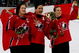 TURIN, ITALY - FEBRUARY 20: (L-R) Cassie Campbell #77, Vicky Sunohara #61 and Jayna Hefford #16 all of Canada celebrate winning the gold medal in women's ice hockey with a 4-1 victory over Sweden during Day 10 of the Turin 2006 Winter Olympic Games on February 20, 2006 at the Palasport Olimpico in Turin, Italy. (Photo by Brian Bahr/Getty Images)