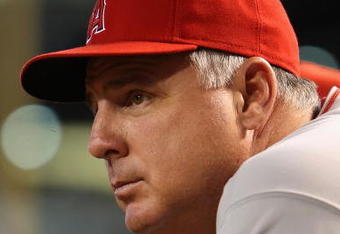 PHOENIX - JUNE 27:  Manager Mike Scioscia of the Los Angeles Angels of Anaheim watches from the dugout during the major league baseball game against the Arizona Diamondbacks at Chase Field on June 27, 2009 in Phoenix, Arizona. The Angels defeated the Diamondbacks 2-1.  (Photo by Christian Petersen/Getty Images)