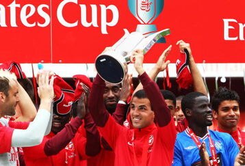LONDON, ENGLAND - AUGUST 02:  Arsenal  captain Cesc Fabregas lifts the Trophy following his team's victory during the Emirates Cup match between Arsenal and Glasgow Rangers at the Emirates Stadium on August 2, 2009 in London, England.  (Photo by Phil Cole/Getty Images)