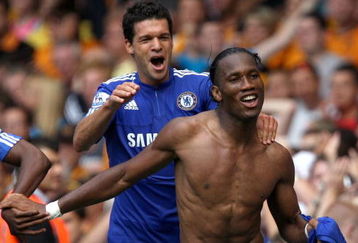 LONDON, ENGLAND - AUGUST 15:  Didier Drogba of Chelsea celebrates after scoring the winning goal against Hull City with teammate Michael Ballack (R) during the Barclays Premier League match between Chelsea and Hull City at Stamford Bridge on August 15, 2009 in London, England.  (Photo by Hamish Blair/Getty Images)