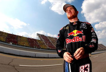 BROOKLYN, MI - AUGUST 14:  Brian Vickers driver of the #83 RedBull Toyota stands on the grid after qualifying for the NASCAR Sprint Cup Series Michigan 400 at Michigan Internetional Speedway on August 14, 2009 in Brooklyn, Michigan.  (Photo by Jason Smith/Getty Images)