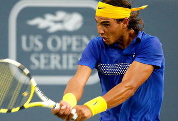 MONTREAL, QC - AUGUST 12:  Rafael Nadal of Spain returns a shot to David Ferrer of Spain during the Rogers Cup at Uniprix Stadium on August 12, 2009 in Montreal, Canada.  (Photo by Matthew Stockman/Getty Images)