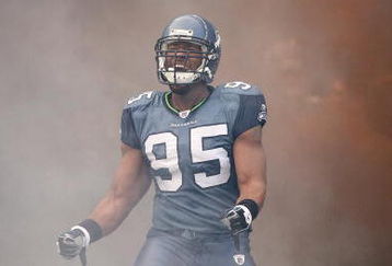 SEATTLE - DECEMBER 07:  Lawrence Jackson #95 of the Seattle Seahawks celebrates as he enters the field before the game against the New England Patriots on December 7, 2008 at Qwest Field in Seattle, Washington. The Patriots defeated the Seahawks 24-21. (Photo by Otto Greule Jr/Getty Images)