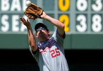 DENVER - JULY 08:  Rightfielder Austin Kearns #25 of the Washington Nationals tracks down a fly ball against the Colorado Rockies during MLB action at Coors Field on July 8, 2009 in Denver, Colorado. The Rockies defeated the Nationals 10-4.  (Photo by Doug Pensinger/Getty Images)