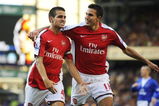 LIVERPOOL, ENGLAND - AUGUST 15:   Francesc Fabregas of Arsenal is congratulated by teammate Robin van Persie (R) after scoring his team's fourth goal during the Barclays Premier League match between Everton and Arsenal at Goodison Park on August 15, 2009 in Liverpool, England. (Photo by Michael Regan/Getty Images)