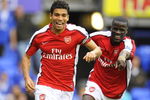 LIVERPOOL, ENGLAND - AUGUST 15:   Da Silva Eduardo of Arsenal celebrates with teammate Emmanuel Eboue (R) after scoring his team's sixth goal during the Barclays Premier League match between Everton and Arsenal at Goodison Park on August 15, 2009 in Liverpool, England. (Photo by Michael Regan/Getty Images)
