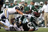 EAST RUTHERFORD, NJ - AUGUST 14:  Leon Washington #29 of the New York Jets is tackled against the St. Louis Rams during their preseason game at Giants Stadium on August 14, 2009  in East Rutherford, New Jersey.  (Photo by Nick Laham/Getty Images)