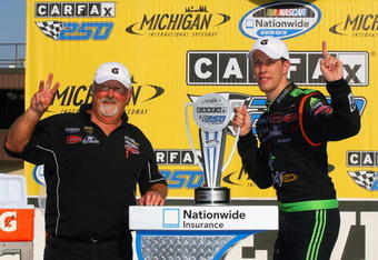 BROOKLYN, MI - AUGUST 15:  Brad Keselowski, driver of the #88 GoDaddy Chevrolet, celebrates with his crew cheif Tony Eury Sr. in victory lane after Keselowski won the NASCAR Nationwide Series CARFAX 250 at Michigan International Speedway on August 15, 2009 in Brooklyn, Michigan.  (Photo by Jason Smith/Getty Images)