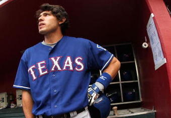 PHOENIX - JUNE 23:  Ian Kinsler #5 of the Texas Rangers stands in the dugout before the major league baseball game against the Arizona Diamondbacks at Chase Field on June 23, 2009 in Phoenix, Arizona. The Diamondbacks defeated the Rangers 8-2.  (Photo by Christian Petersen/Getty Images)
