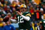 GREEN BAY, WI - DECEMBER 07:  Quarterback Aaron Rodgers #12 of the Green Bay Packers drops back to pass against the Houston Texans during the first quarter at Lambeau Field on December 7, 2008 in Green Bay, Wisconsin. The Texans defeated the Packers 24-21.  (Photo by Jeff Gross/Getty Images)