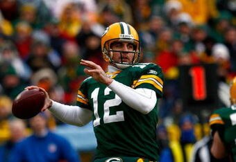 GREEN BAY, WI - DECEMBER 07:  Quarterback Aaron Rodgers #12 of the Green Bay Packers drops back to pass against the Houston Texans during the first quarter at Lambeau Field on December 7, 2008 in Green Bay, Wisconsin. The Texans defeated the Packers 24-21.  (Photo by Jeff Gross/Getty Images)