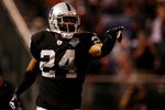 OAKLAND, CA - AUGUST 13:  Safety Michael Huff #24 of the Oakland Raiders celebrates after making an interception against the Dallas Cowboys during the preseason game at Oakland-Alameda County Coliseum on August 13, 2009 in Oakland, California. (Photo by Jed Jacobsohn/Getty Images)