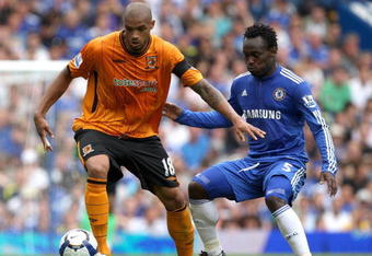LONDON, ENGLAND - AUGUST 15:  Caleb Folan of Hull City and Michael Essien of Chelsea battle for the ball  during the Barclays Premier League match between Chelsea and Hull City at Stamford Bridge on August 15, 2009 in London, England.  (Photo by Hamish Blair/Getty Images)