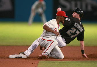 MIAMI - JUNE 12:  Shortstop Jimmy Rollins #11 of the Philadelphia Phillies applies a late tag as Jeremy Hermida #27 of the Florida Marlins steals second base at Dolphin Stadium June 12, 2008 in Miami, Florida.  (Photo by Doug Benc/Getty Images)