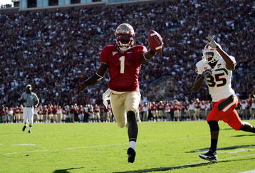 TALLAHASSEE, FL - OCTOBER 20:  Quarterback Xavier Lee #1 of the Florida State Seminoles runs in a touchdown against safety Lovon Ponder #35 from the University of Miami Hurricanes at Bobby Bowden Field at Doak Campbell Stadium October 20, 2007 in Tallahassee, Florida.  (Photo by Marc Serota/Getty Images)