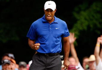 CHASKA, MN - AUGUST 15:  Tiger Woods celebrates a birdie on the 14th hole during the third round of the 91st PGA Championship at Hazeltine National Golf Club on August 15, 2009 in Chaska, Minnesota.  (Photo by Streeter Lecka/Getty Images)