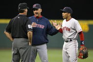 SEATTLE - MAY 27: Manager Terry Francona #47 and shortstop Julio Lugo #23 of the Boston Red Sox argue with third base umpire Angel Hernandez after being ejected in the fifth inning against the Seattle Mariners May 27, 2008 at Safeco Field in Seattle, Washington. (Photo by Otto Greule Jr/Getty Images)
