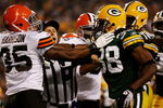GREEN BAY, WI - AUGUST 15:  A referee breaks up a fight between Jerome Harrison #35 of the Cleveland Browns and Tramon Williams #38 of the Green Bay Packers in the second quarter during the preseason game at Lambeau Field on August 15, 2009 in Green Bay, Wisconsin. (Photo by Jonathan Daniel/Getty Images)