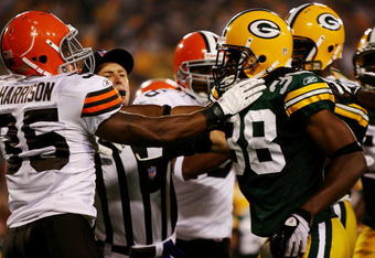 GREEN BAY, WI - AUGUST 15:  A referee breaks up a fight between Jerome Harrison #35 of the Cleveland Browns and Tramon Williams #38 of the Green Bay Packers in the second quarter during the preseason game at Lambeau Field on August 15, 2009 in Green Bay, Wisconsin. (Photo by Jonathan Daniel/Getty Images)