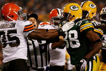 GREEN BAY, WI - AUGUST 15:  A referee breaks up a fight between Jerome Harrison #35 of the Cleveland Browns and Tramon Williams #38 of the Green Bay Packers in the second quarter during the preseason game at Lambeau Field on August 15, 2009 in Green Bay, Wisconsin. (Photo by Jonathan Daniel/Getty Images)