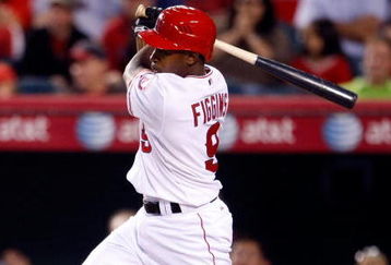 ANAHEIM, CA - AUGUST 10:  Chone Figgins #9 of the Los Angeles Angels of Anaheim hits a single scoring teammate Erick Aybar in the second inning against the Tampa Bay Rays at Angel Stadium on August 10, 2009 in Anaheim, California. The Angels defeated the Rays 8-7.  (Photo by Jeff Gross/Getty Images)