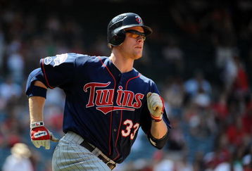 ANAHEIM, CA - JULY 26:  Justin Morneau #33 of the Minnesota Twins runs to first against the Los Angeles Angels of Anaheim at Angels Stadium on July 26, 2009 in Anaheim, California.  (Photo by Harry How/Getty Images)
