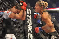 SAN JOSE, CA - AUGUST 15: Cris Cyborg (R) battles Gina Carano during their Middleweight Championship fight at Stikeforce: Carano vs. Cyborg on August 15, 2009 in San Jose, California. (Photo by Jon Kopaloff/Getty Images)
