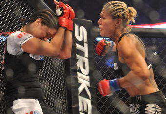 SAN JOSE, CA - AUGUST 15:  Cris Cyborg (R) battles Gina Carano during their Middleweight Championship fight at Stikeforce: Carano vs. Cyborg on August 15, 2009 in San Jose, California.  (Photo by Jon Kopaloff/Getty Images)