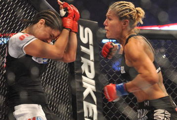 SAN JOSE, CA - AUGUST 15:  Cris Cyborg (R) battles Gina Carano during their Middleweight Championship fight at Stikeforce: Carano vs. Cyborg on August 15, 2009 in San Jose, California.  (Photo by Jon Kopaloff/Getty Images)