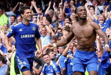 LONDON, ENGLAND - AUGUST 15:  Didier Drogba of Chelsea celebrates after scoring the winning goal against Hull City with teammate Michael Ballack (R) during the Barclays Premier League match between Chelsea and Hull City at Stamford Bridge on August 15, 2009 in London, England.  (Photo by Hamish Blair/Getty Images)