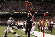 NEW ORLEANS - AUGUST 14:  Wide receiver Chris Henry #15 of the Cincinnati Bengals catches the ball in the end zone for a touchdown against Jason David #29 of the New Orleans Saints during the preseason game on August 14, 2009 at the Superdome in New Orleans, Louisiana. (Photo by Chris Graythen/Getty Images)
