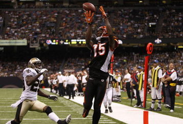 NEW ORLEANS - AUGUST 14:  Wide receiver Chris Henry #15 of the Cincinnati Bengals catches the ball in the end zone for a touchdown against Jason David #29 of the New Orleans Saints during the preseason game on August 14, 2009 at the Superdome in New Orleans, Louisiana. (Photo by Chris Graythen/Getty Images)
