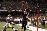 NEW ORLEANS - AUGUST 14:  Wide receiver Chris Henry #15 of the Cincinnati Bengals catches the ball in the end zone for a touchdown against Jason David #29 of the New Orleans Saints during the preseason game on August 14, 2009 at the Superdome in New Orleans, Louisiana. (Photo by Chris Graythen/Getty Images)
