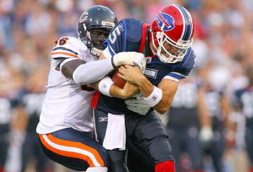 ORCHARD PARK, NY - AUGUST 15:  Trent Edwards #5  of the Buffalo Bills is tackled by Alex Brown #96 of  the Chicago Bears on August 15, 2009 at Ralph Wilson Stadium in Orchard Park, New York.  (Photo by Rick Stewart/Getty Images)