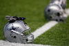 SAN ANTONIO - AUGUST 06:  Helmets of the Dallas Cowboys during training camp at the Alamodome on August 6, 2009 in San Antonio, Texas.  (Photo by Ronald Martinez/Getty Images)