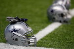 SAN ANTONIO - AUGUST 06:  Helmets of the Dallas Cowboys during training camp at the Alamodome on August 6, 2009 in San Antonio, Texas.  (Photo by Ronald Martinez/Getty Images)