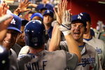 PHOENIX - AUGUST 16:  Mark Loretta #5 of the Los Angeles Dodgers congratulates pitcher Randy Wolf #43 after Wolf hit a 2 run home run against the Arizona Diamondbacks during the fourth inning of the major league baseball game at Chase Field on August 16, 2009 in Phoenix, Arizona.  (Photo by Christian Petersen/Getty Images)