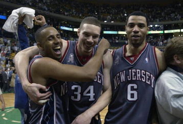 EAST RUTHERFORD, NJ - MAY 31:   Lucious Harris #12, Aaron Williams #34, and Kenyon Martin #6 of the New Jersey Nets celebrate after they defeated the Boston Celtic in Game 6 of the Eastern Conference Finals at the Fleet Center in Boston Massachusetts on May 31, 2002. NOTE TO USER: User expressly acknowledges and agrees that, by downloading and/or using this Photograph, User is consenting to the terms and conditions of the Getty Images License Agreement. Mandatory copyright notice: Copyright 2002 NBAE (Photo by Ezra Shaw/Getty Images)