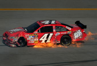TALLADEGA, AL - APRIL 26:  Jeremy Mayfield, driver of the #41 Big Red Toyota, suffers damage during the NASCAR Sprint Cup Series Aaron's 499 at Talladega Superspeedway on April 26, 2009 in Talladega, Alabama.  (Photo by Jason Smith/Getty Images for NASCAR)