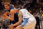 DENVER - MAY 13:  Dirk Nowitzki #41 of the Dallas Mavericks tries to drive against Chris Andersen #11 of the Denver Nuggets in Game Five of the Western Conference Semifinals during the 2009 NBA Playoffs at Pepsi Center on May 13, 2009 in Denver, Colorado. NOTE TO USER: User expressly acknowledges and agrees that, by downloading and or using this photograph, User is consenting to the terms and conditions of the Getty Images License Agreement.  (Photo by Doug Pensinger/Getty Images)