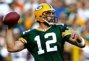 GREEN BAY, WI - AUGUST 15:  Quarterback Aaron Rodgers #12 of the Green Bay Packers passes the ball in the first quarter against the Cleveland Browns during the preseason game at Lambeau Field on August 15, 2009 in Green Bay, Wisconsin. (Photo by Jonathan Daniel/Getty Images)