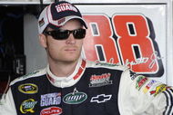 BROOKLYN, MI - AUGUST 15:  Dale Earnhardt Jr. driver of the #88 National Guard/AMP Energy Chevrolet, stands in the garage during practice for the NASCAR Sprint Cup Series Michigan 400 at Michigan Internetional Speedway on August 15, 2009 in Brooklyn, Michigan.  (Photo by John Harrelson/Getty Images for NASCAR)