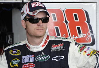 BROOKLYN, MI - AUGUST 15:  Dale Earnhardt Jr. driver of the #88 National Guard/AMP Energy Chevrolet, stands in the garage during practice for the NASCAR Sprint Cup Series Michigan 400 at Michigan Internetional Speedway on August 15, 2009 in Brooklyn, Michigan.  (Photo by John Harrelson/Getty Images for NASCAR)