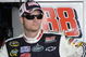 BROOKLYN, MI - AUGUST 15:  Dale Earnhardt Jr. driver of the #88 National Guard/AMP Energy Chevrolet, stands in the garage during practice for the NASCAR Sprint Cup Series Michigan 400 at Michigan Internetional Speedway on August 15, 2009 in Brooklyn, Michigan.  (Photo by John Harrelson/Getty Images for NASCAR)
