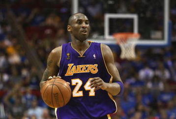ORLANDO, FL - JUNE 14:  Kobe Bryant #24 of the Los Angeles Lakers moves the ball against the Orlando Magic in Game Five of the 2009 NBA Finals on June 14, 2009 at Amway Arena in Orlando, Florida. The Lakers won 99-86. NOTE TO USER:  User expressly acknowledges and agrees that, by downloading and or using this photograph, User is consenting to the terms and conditions of the Getty Images License Agreement. (Photo by Elsa/Getty Images) 