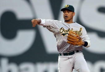 BOSTON - JULY 28:  Orlando Cabrera #18 of the Oakland Athletics sends the ball to first base for the out against the Boston Red Sox on July 28, 2009 at Fenway Park in Boston, Massachusetts.  (Photo by Elsa/Getty Images)