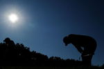 CHASKA, MN - AUGUST 16:  Tiger Woods (R) reacts to his tee shot on the 17th hole as caddie Steve Williams walks off during the final round of the 91st PGA Championship at Hazeltine National Golf Club on August 16, 2009 in Chaska, Minnesota.  (Photo by Stuart Franklin/Getty Images)