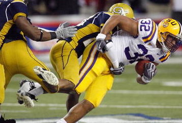 ATLANTA - DECEMBER 31:  Charles Scott #32 of the LSU Tigers is tackled as he carries the ball during the Chick-fil-A Bowl against the Georgia Tech Yellow Jackets on December 31, 2008 at the Georgia Dome in Atlanta, Georgia. (Photo by Kevin C. Cox/Getty Images)